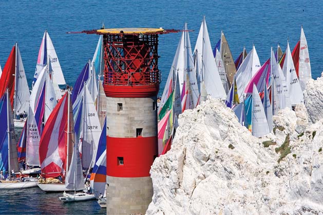 A press of spinnakers as the fleet rounds The Needles in 2006. ©Th.Martinez