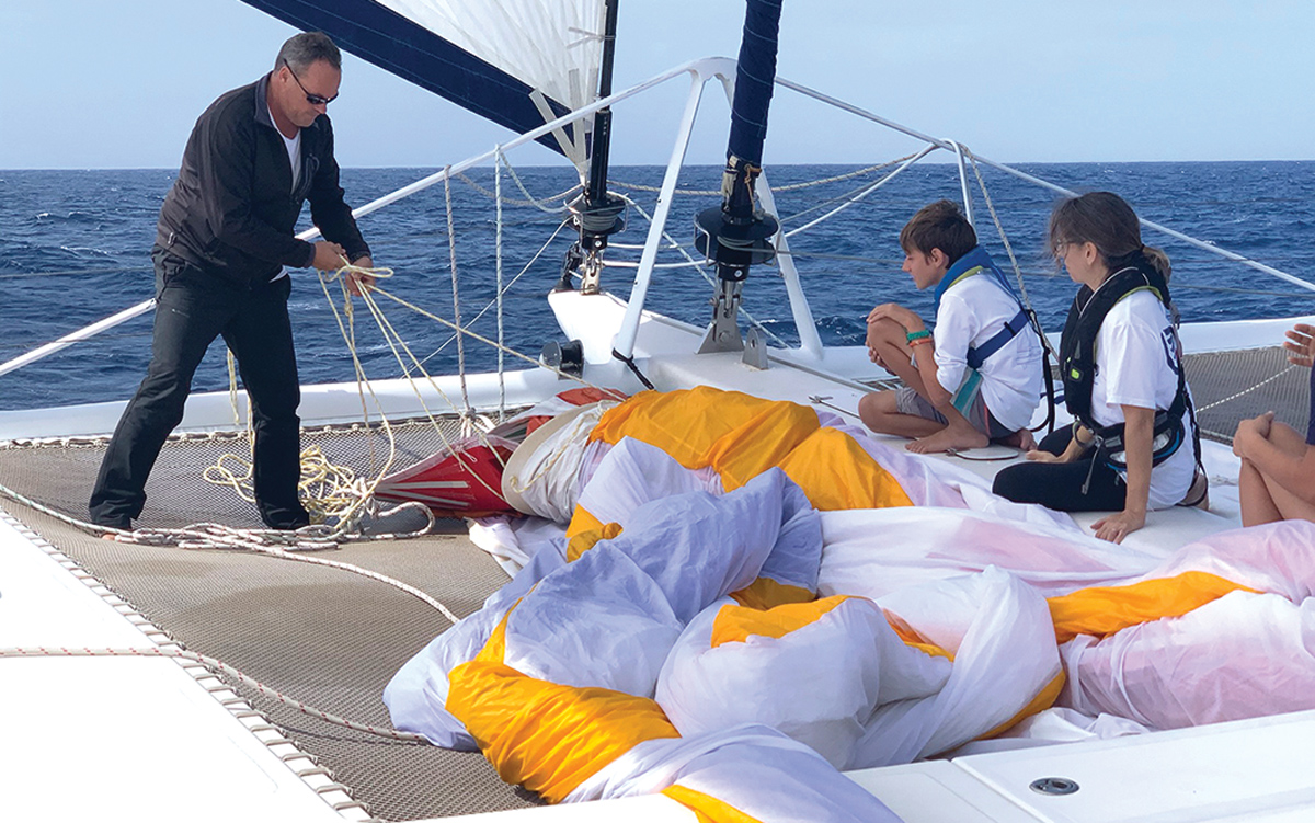 2019-arc-survey-sail-handling-Catana-65-foredeck-credit-Steve-Frary