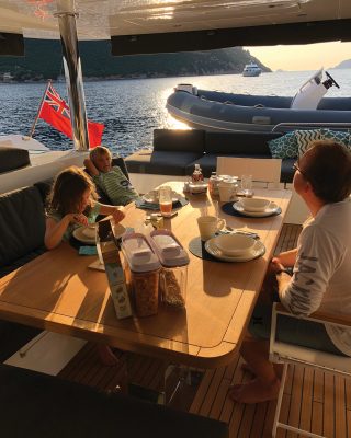 sardinia-charter-catamaran-lagoon-620-aft-deck-breakfast-credit-helen-fretter