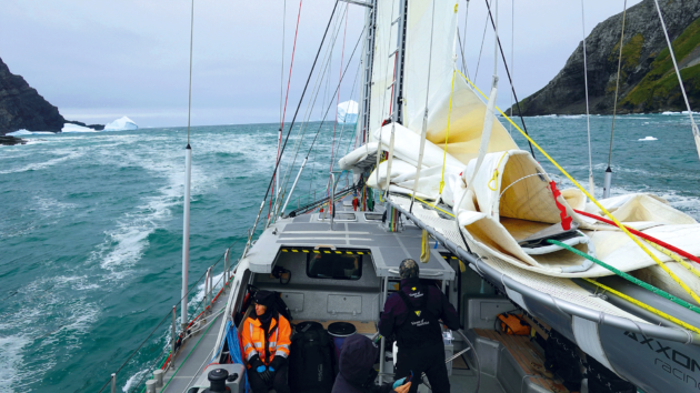 motor sailing through the narrow unsounded passage between Saddle Island and the South Georgia mainland.